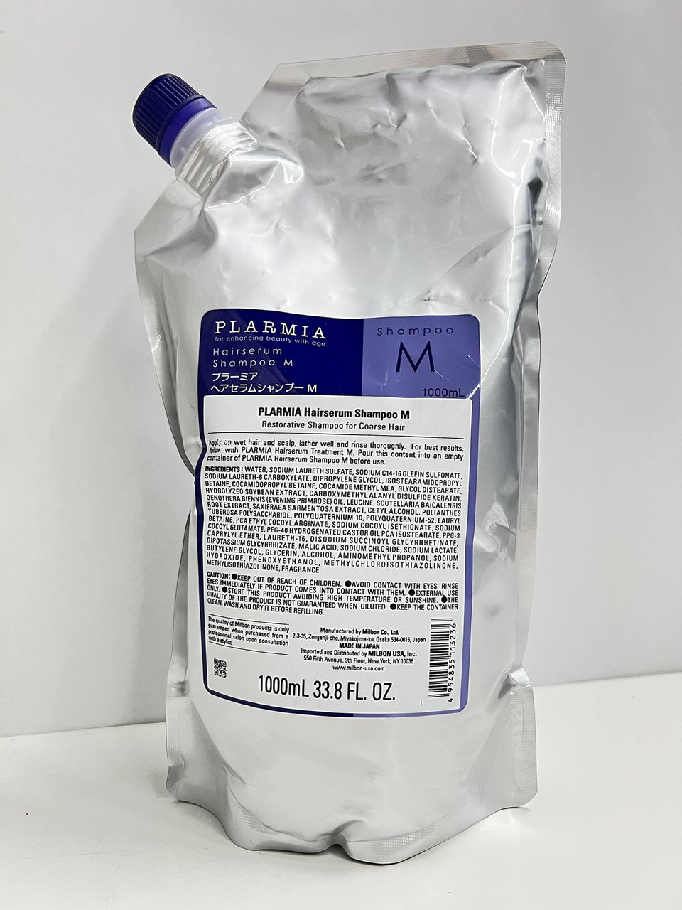 Milbon front packaging 33.8 oz bottle showing product label and professional presentation