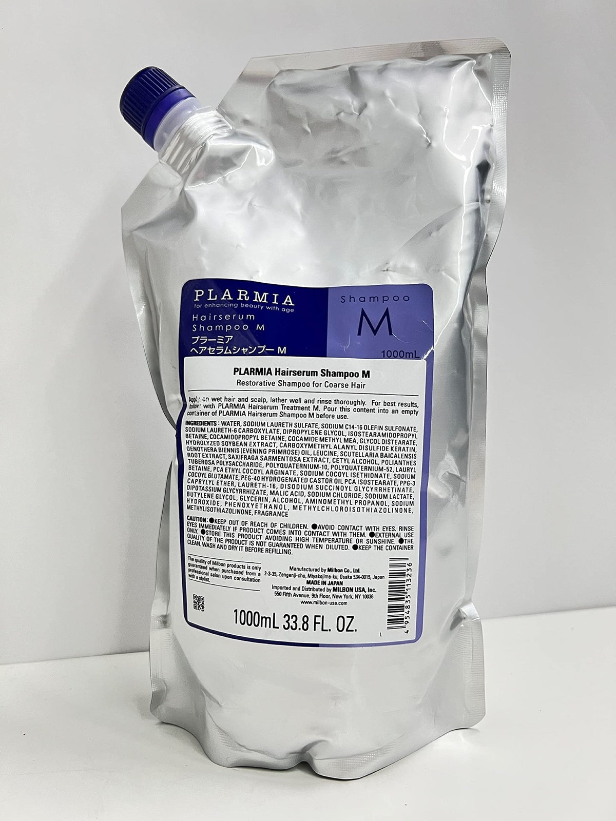 Milbon texture close-up of creamy lather demonstrating gentle cleansing and moisturizing effect