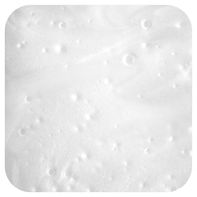 MILD BY NATURE shampoo lather texture illustrating gentle, voluminous foam