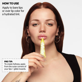 Milk Makeup balmade applied on lips showing sheer tint and plumping effect