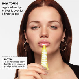 Milk Makeup balmade placed beside a purse for on-the-go hydration convenience