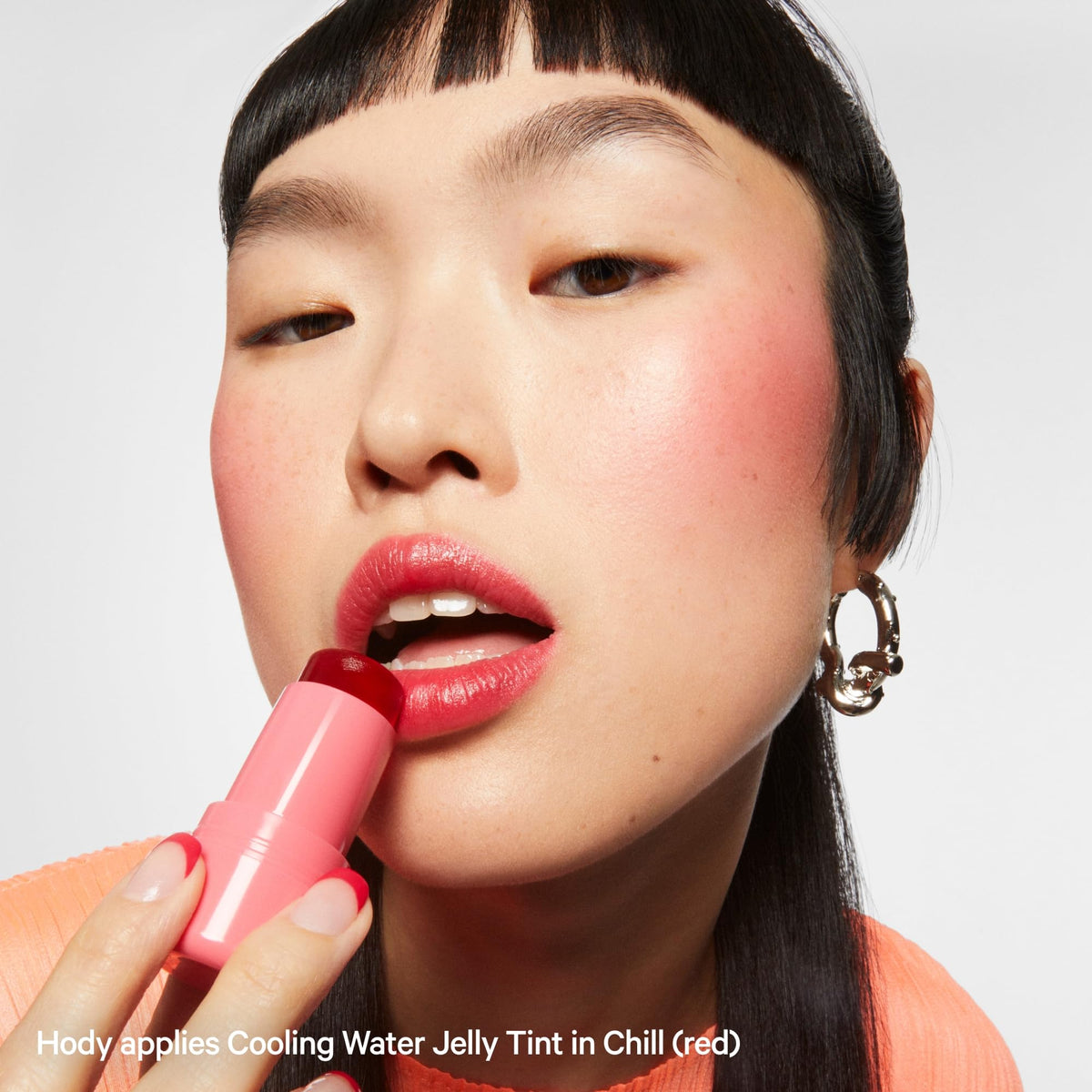 Milk Makeup tint styled on tabletop conveying clean, modern brand aesthetic