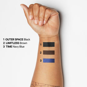 Milk Makeup Infinity beside hand for scale to show compact size and portability benefit