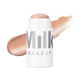 Milk Makeup front stick view showing compact travel-friendly design and glow