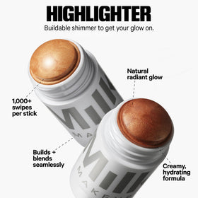 Milk Makeup trio held in hand to show full‑size scale and travel convenience