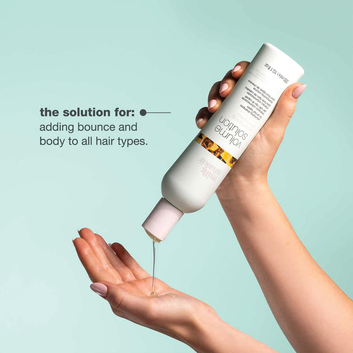 milk_shake applied to wet hair in hand for gentle cleansing benefit