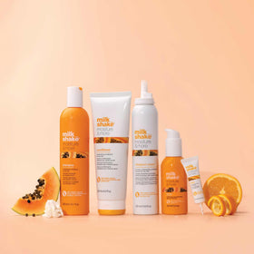 milk_shake held after styling to show polished, touchable hair and styling ease