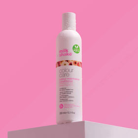 milk_shake conditioner being applied to color-treated hair for detangling