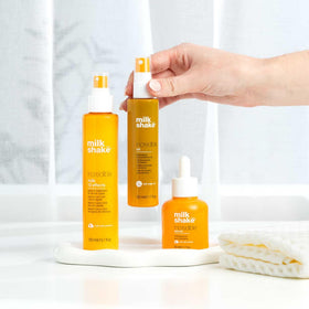 milk_shake travel size on bathroom counter showing compact bottle for on-the-go styling