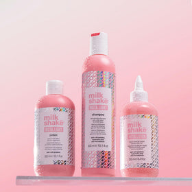 milk_shake next to hand for scale showing 8.4 fl oz size and travel-friendly benefit