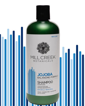 Mill Creek ingredients display with jojoba, argan, and aloe emphasizing natural nourishment