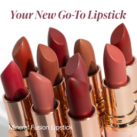 Mineral Fusion lipstick held in hand for size comparison and easy application benefit