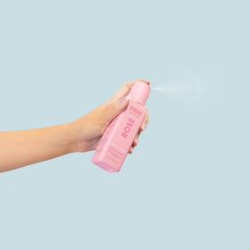 MINETAN BODY.SKIN bottle held in hand to show size and easy-control application