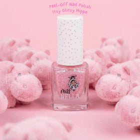 MISS NELLA bottle beside a child hand to show compact size and portability