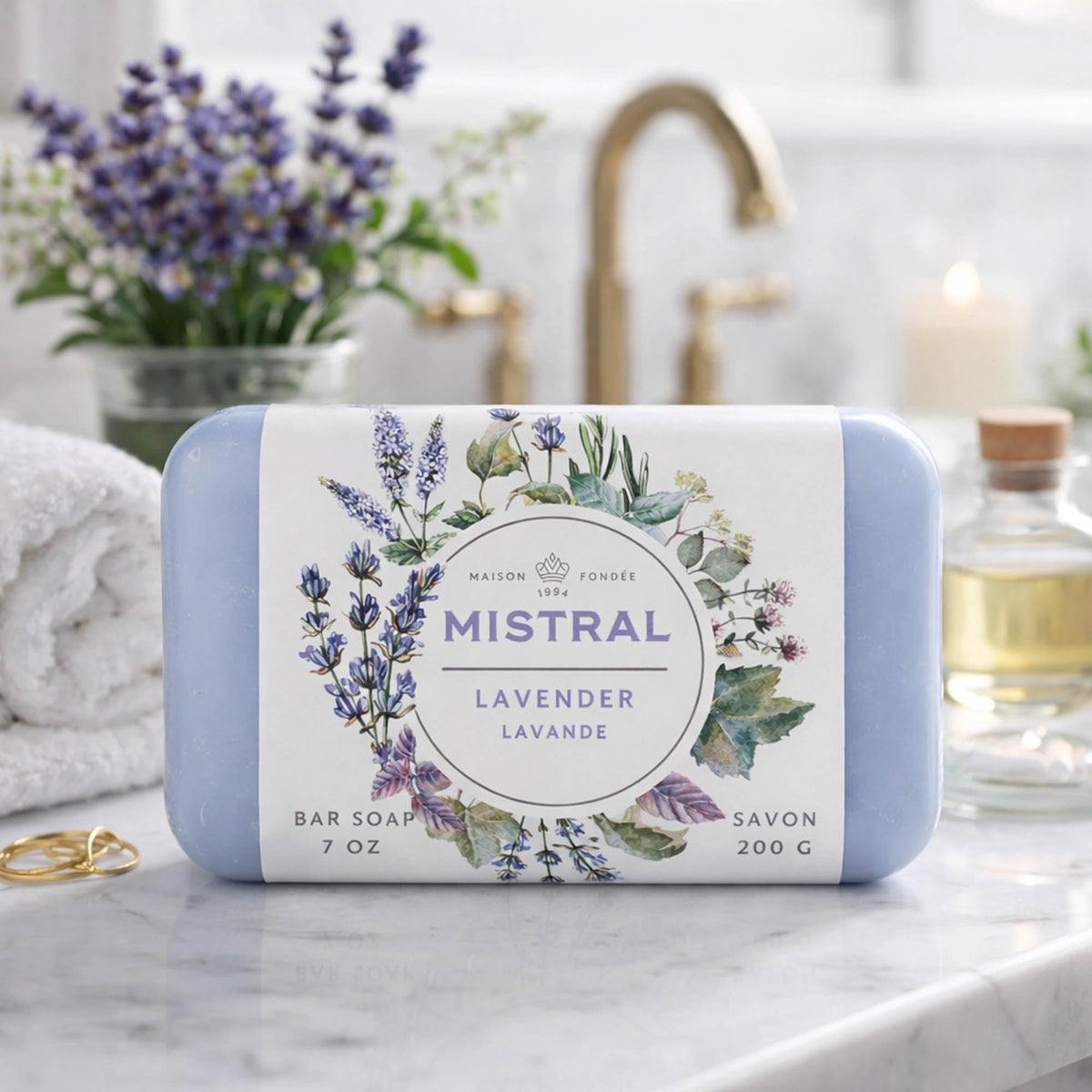 Mistral soap next to hand for scale showing generous 7 oz size