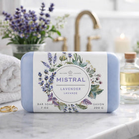 Mistral soap next to hand for scale showing generous 7 oz size