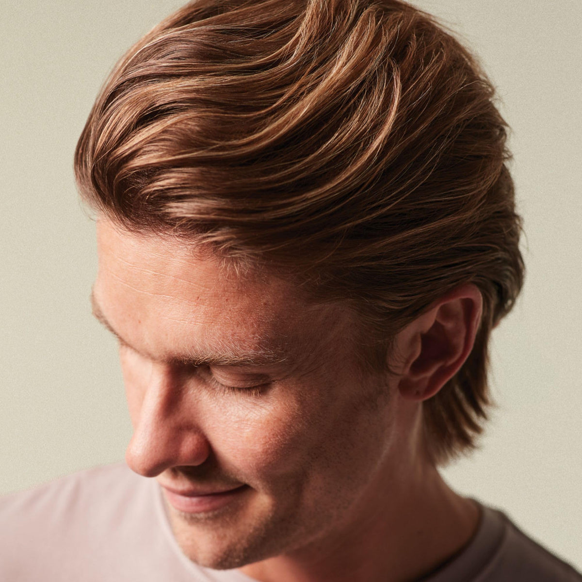 MITCH Calibrate being worked into damp hair for root lift and added volume benefit