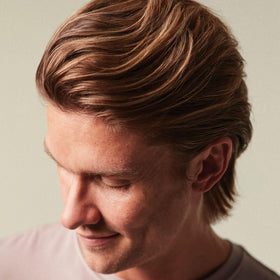 MITCH Calibrate being worked into damp hair for root lift and added volume benefit