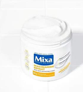 Mixa cream texture closeup showing lightweight spreadable formula
