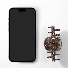 Mixcbe clip holding a bun, showing reliable hold and stylish finish