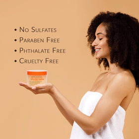 Applying Mixed Chicks cream in hands to show easy spread and styling benefit