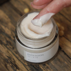 mixsoon cream texture closeup on fingertip showing smooth non-sticky finish and hydration