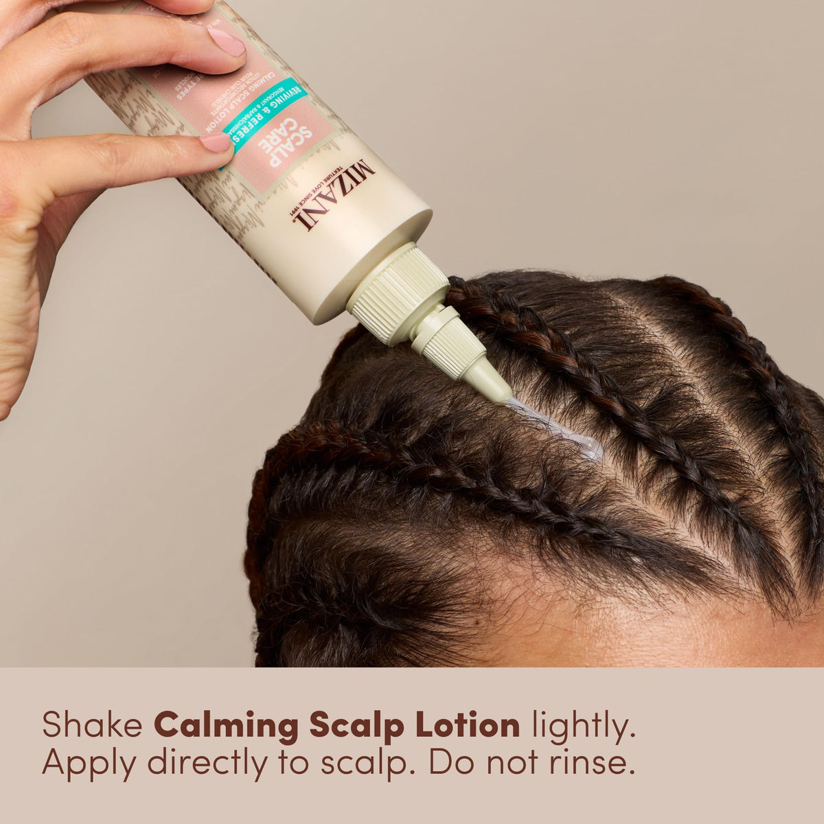 Mizani in-use application on braid parting relieves itch and reduces flakes