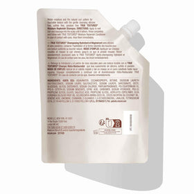 Mizani bottle held in hand to show 16.9 fl oz scale for accurate sizing