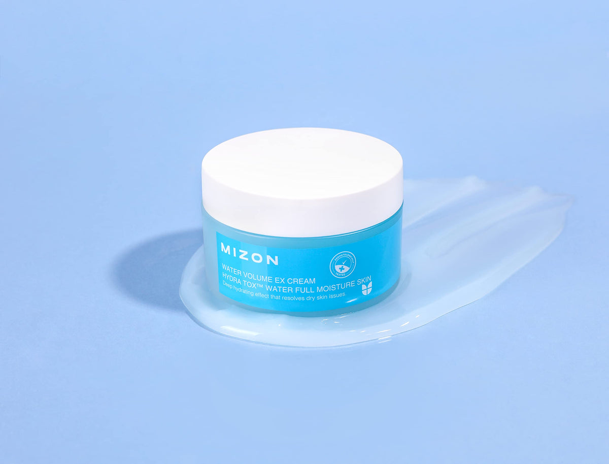 MIZON applying cream to cheek showing hydrated-skin result benefit