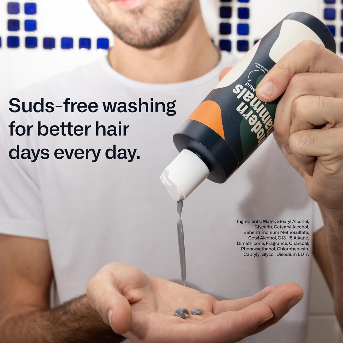 Modern Mammals bottle on shower ledge showing no-suds cleansing benefit