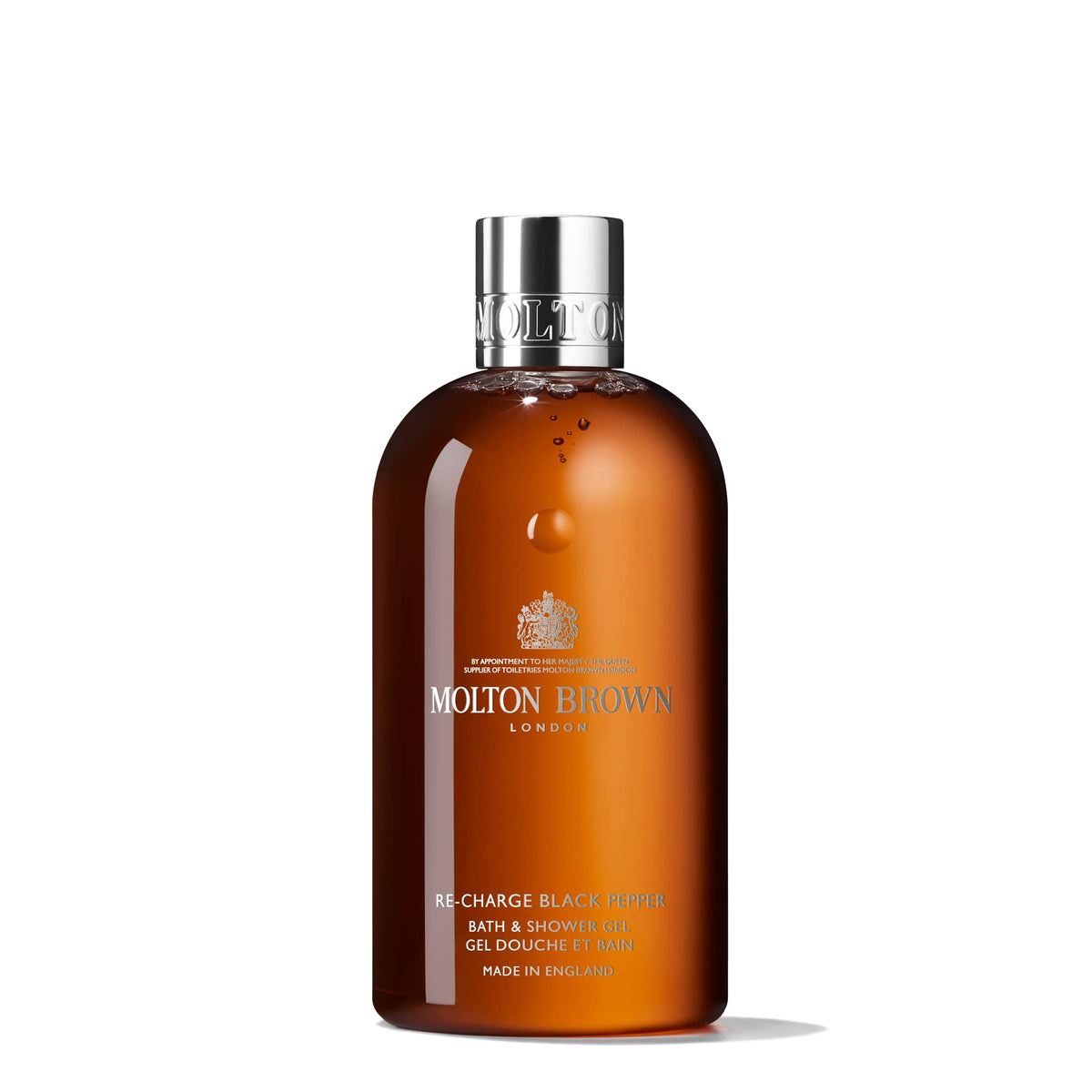 Molton Brown bottle front packaging shows branding and spicy woody scent benefit