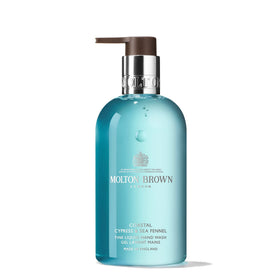 Molton Brown front packaging showing bottle and coastal design, elegant presentation benefit