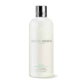 Molton Brown front bottle showing Coastal Cypress & Sea Fennel label and premium packaging benefit