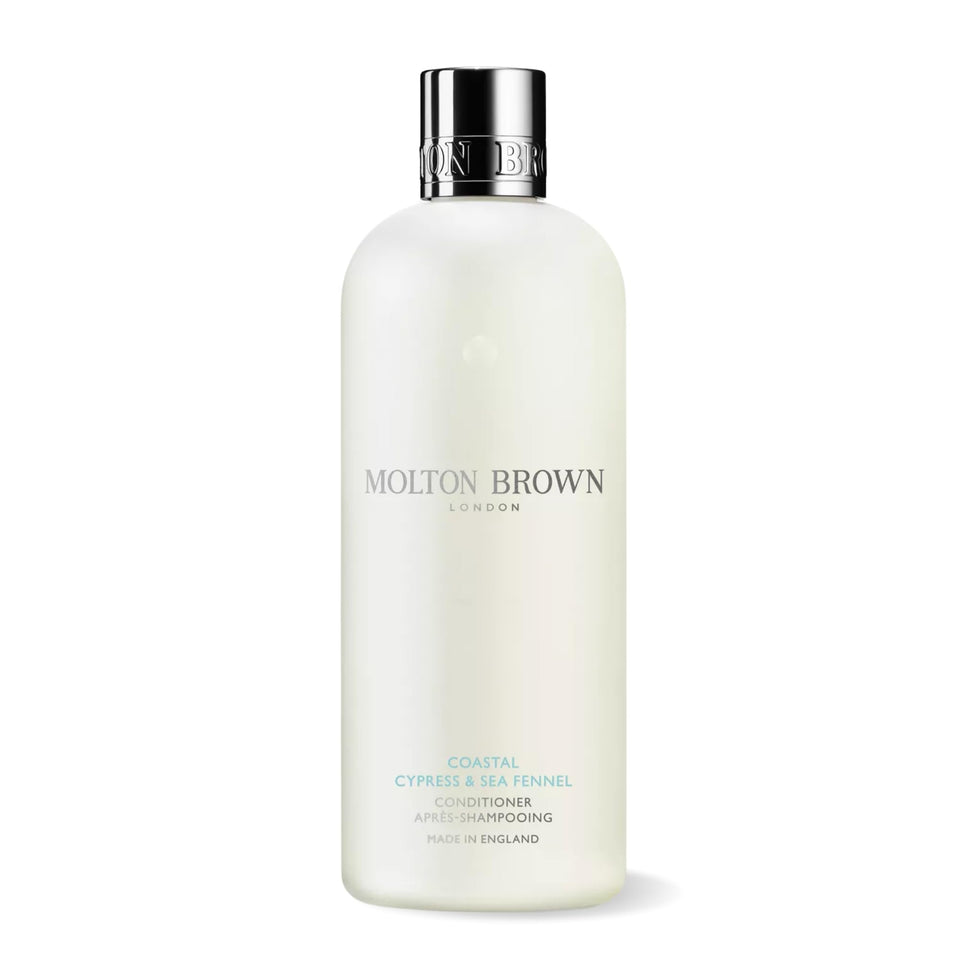 Molton Brown front bottle showing Coastal Cypress & Sea Fennel label and premium packaging benefit