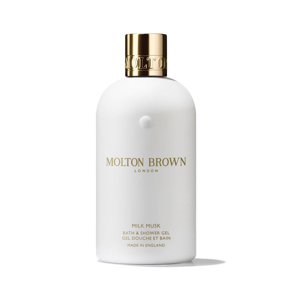 Molton Brown milk musk bottle front showing elegant packaging and clear labeling benefit