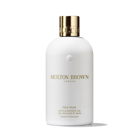 Molton Brown milk musk bottle front showing elegant packaging and clear labeling benefit