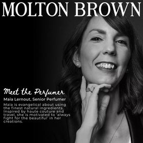 Molton Brown milk musk in shower use poured onto hand demonstrating easy lather benefit