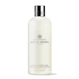 Molton Brown front bottle showing label and size, elegant branding benefit
