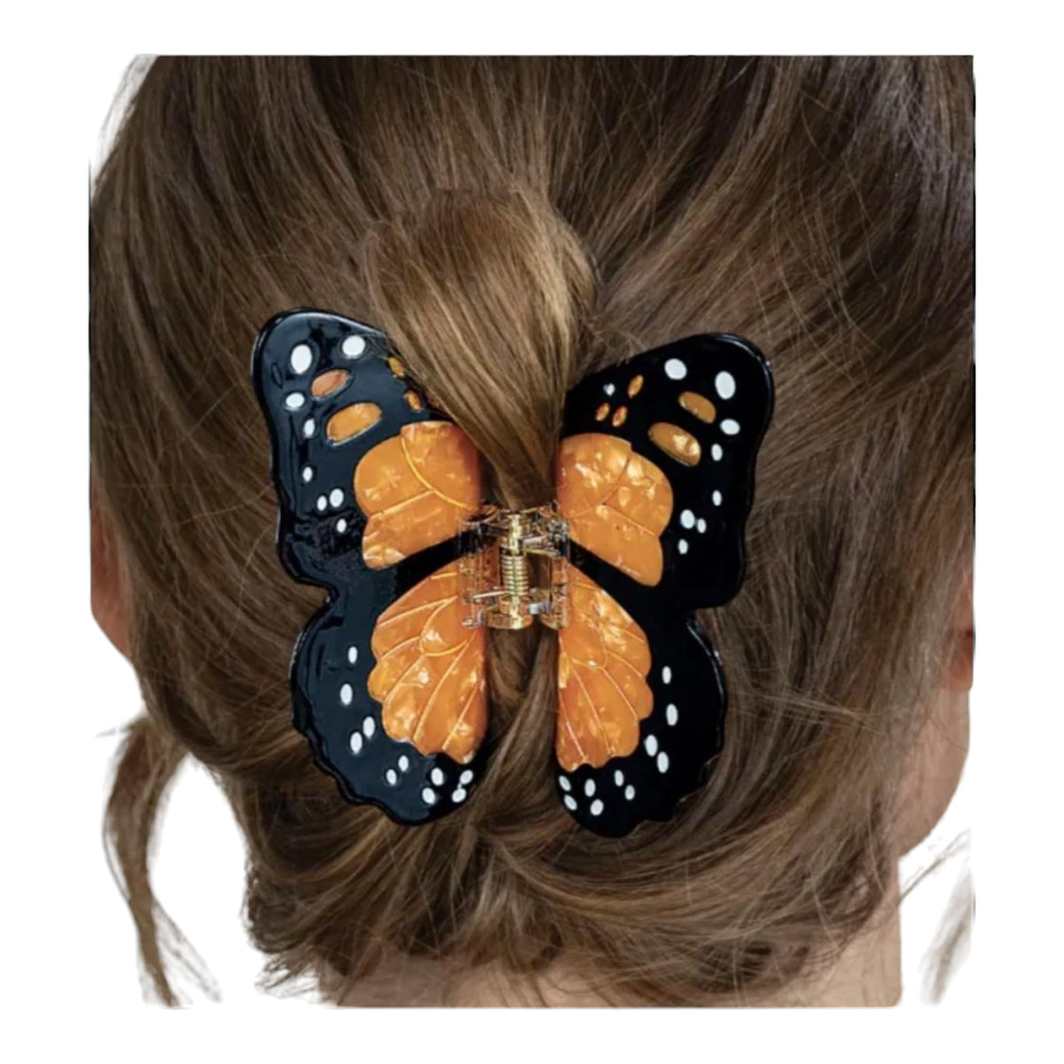 Generic Monarch butterfly clip worn in styled bun, holds hair securely while enhancing appearance