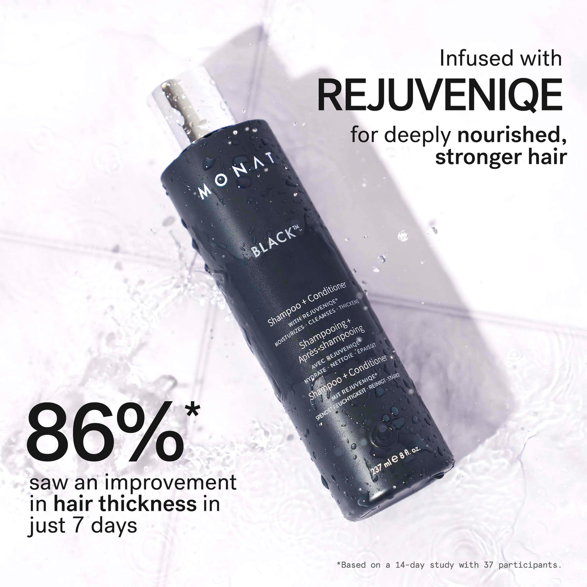 MONAT Black held in hand showing 237ml size and travel convenience