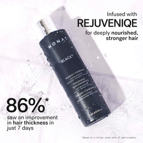 MONAT Black held in hand showing 237ml size and travel convenience
