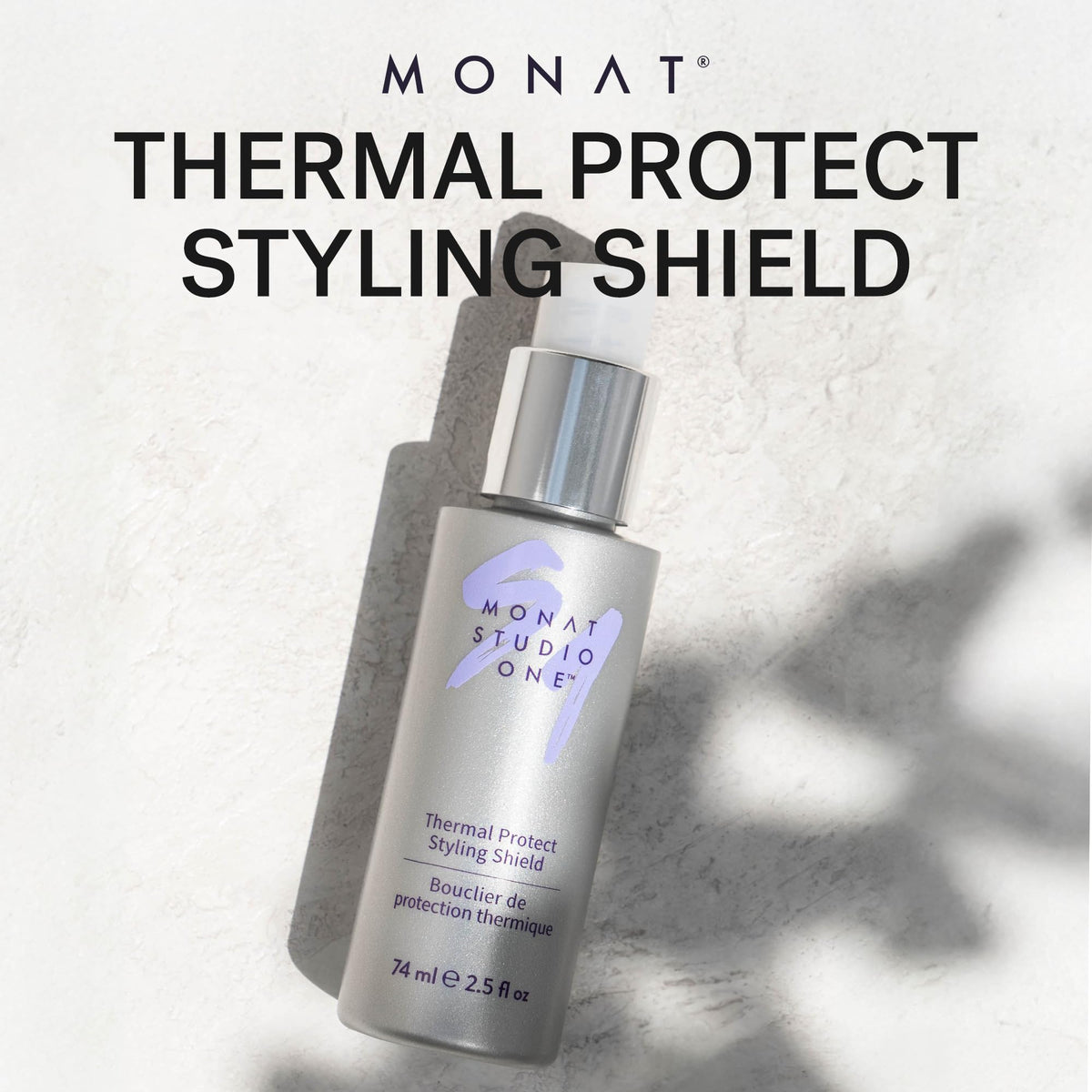 MONAT bottle in hand during application showing simple, quick heat protection