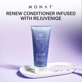MONAT conditioner being applied to wet hair in hand for easy detangling