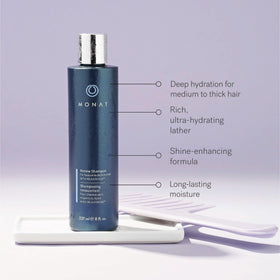 MONAT Renew conditioner texture on fingertips showing lightweight moisture
