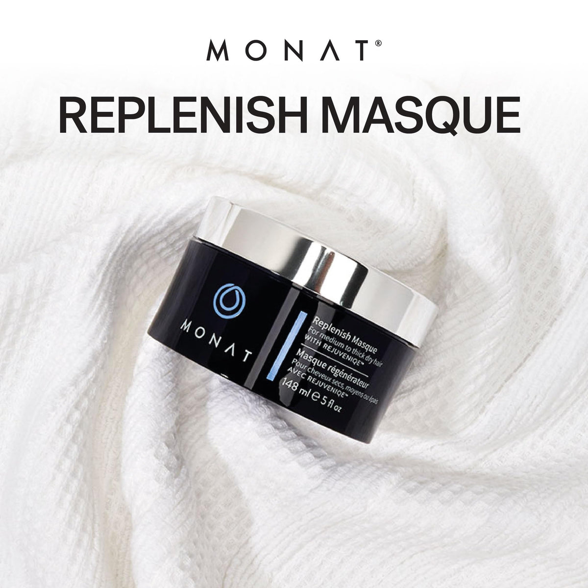 MONAT hand applying masque to mid-lengths to demonstrate easy spread and nourishment