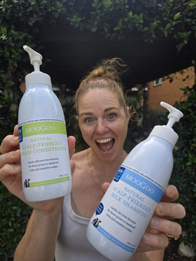 Jojoba and olive oil beside bottle illustrating MooGoo natural hydration