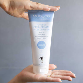 MooGoo being applied to hand to show soothing moisturization