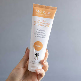 MooGoo cream being dispensed to hand demonstrating easy absorption benefit