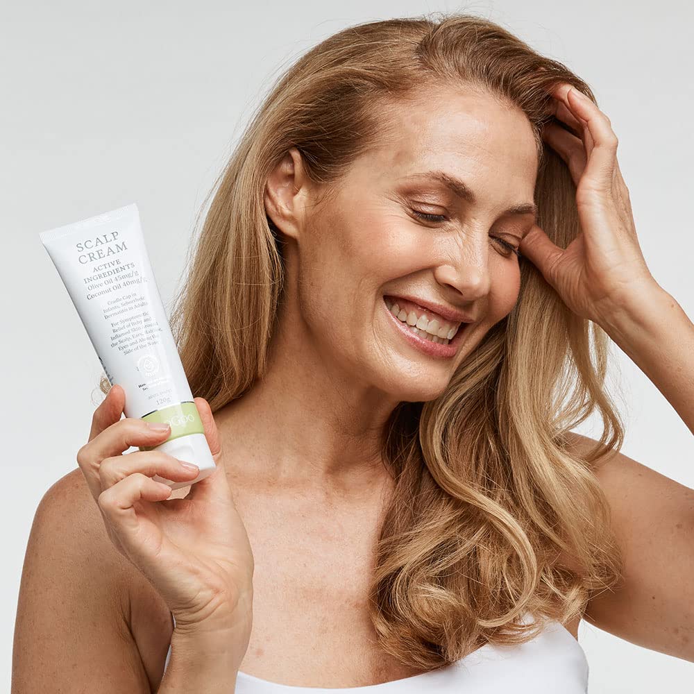 MooGoo applied to baby scalp demonstrating targeted soothing and hydration