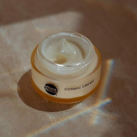 Moon Juice Cosmic Cream applied on hand demonstrating lightweight absorbency benefit